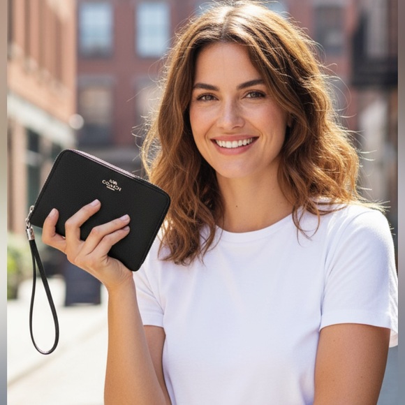 Coach black leather corner zip wristlet. - Picture 1 of 8